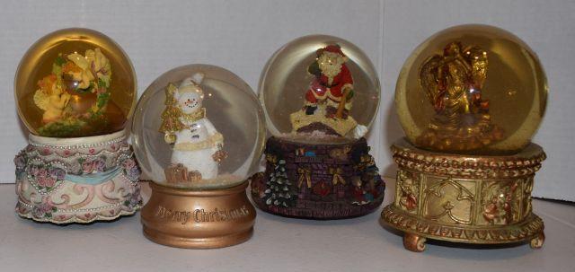 Snow Globes 2 angels bottom is lavender with pink and purple roses light blue ribbon, snowman holdin