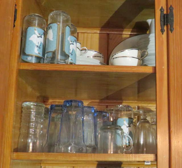 Glassware and dishes in built in dining room cabinet