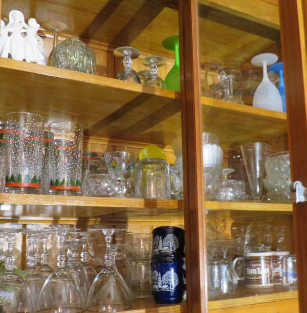 Glassware and dishes in built in dining room cabinet