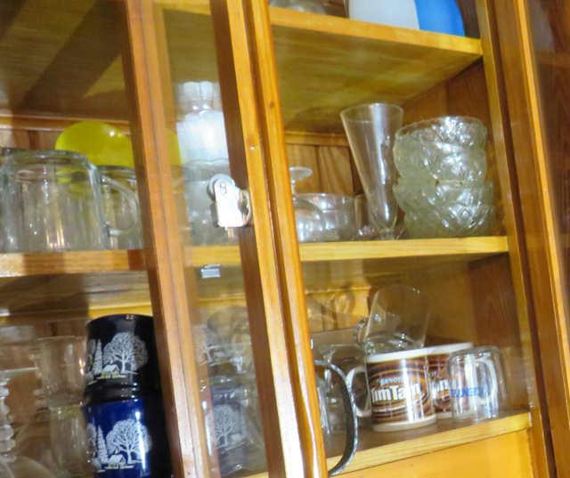 Glassware and dishes in built in dining room cabinet