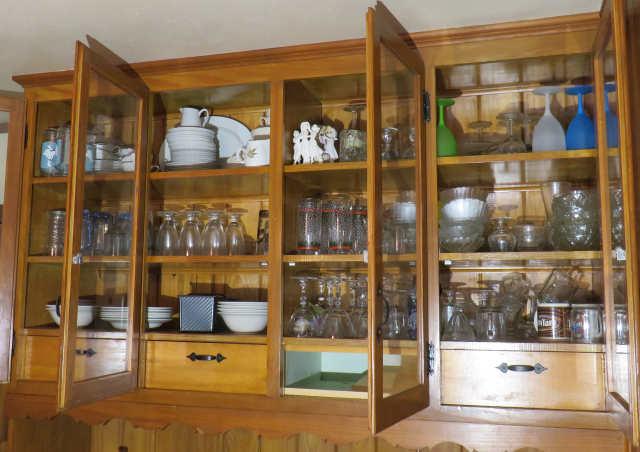 Glassware and dishes in built in dining room cabinet