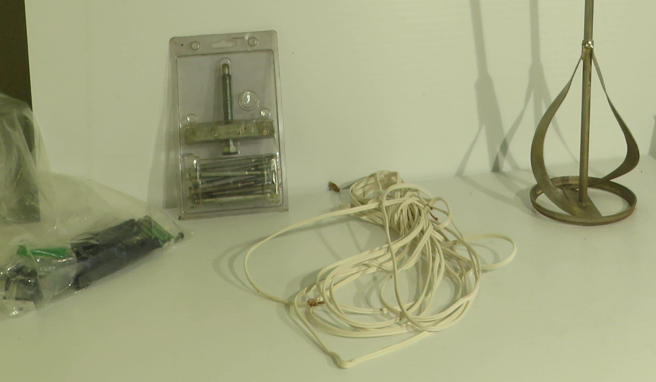 mixed hardware, paint and mud stirrer, remote, extension cord, puller set