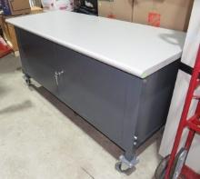 Industrial steel cabinet with Formica top on castors 72" x 30"  adjustable height