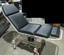Hausted APC transport chair converts to bed.  Good upholstery, hydraulics work properly up and do...