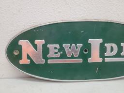 SST Embossed, New Idea Oval Tin Sign
