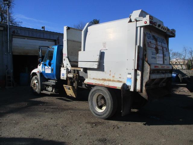 2009 INTERNATIONAL DURASTAR TRUCK WITH WAYNE 10 YD. TOMCAT SERIES SIDE PACKER BODY