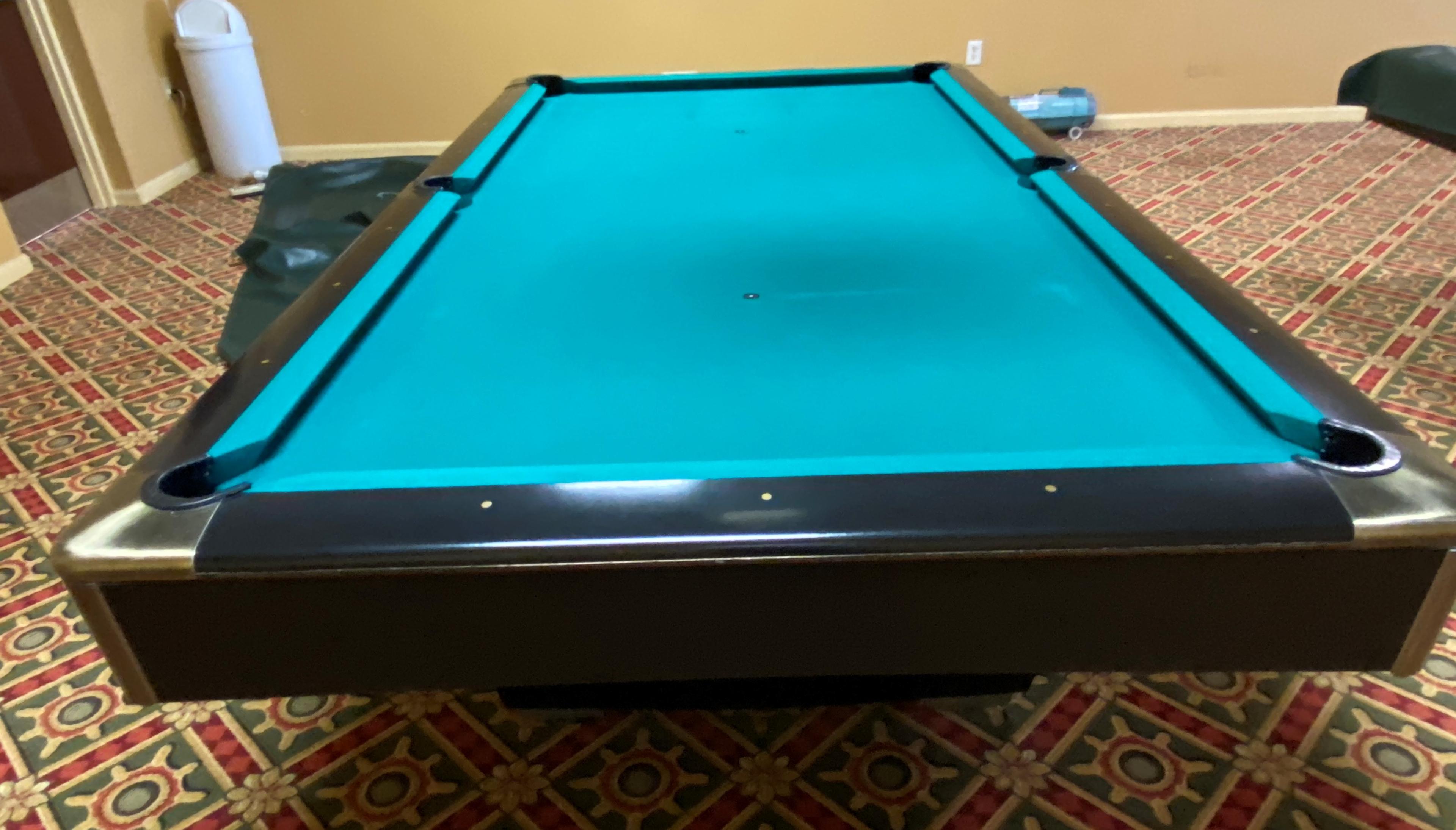 Pool Table with Cover. The Pool Table is in very mint condition