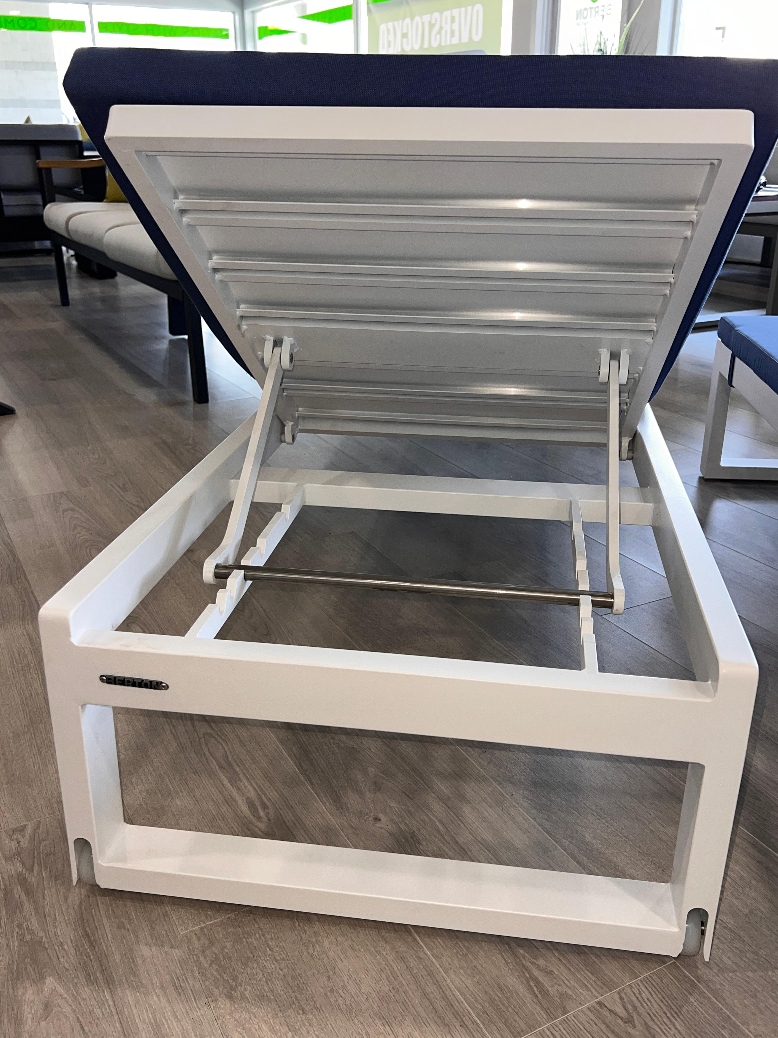 Lounge Chair on Casters, Powder Coated in White Finish with Blue Fabric Cushion.  To Be Picked Up In