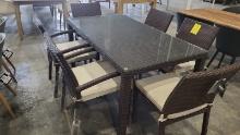 BRAND NEW OUTDOOR Brown Synthetic Wicker 79” x 40” Table With Glass Top and 6 Stacking  Chairs