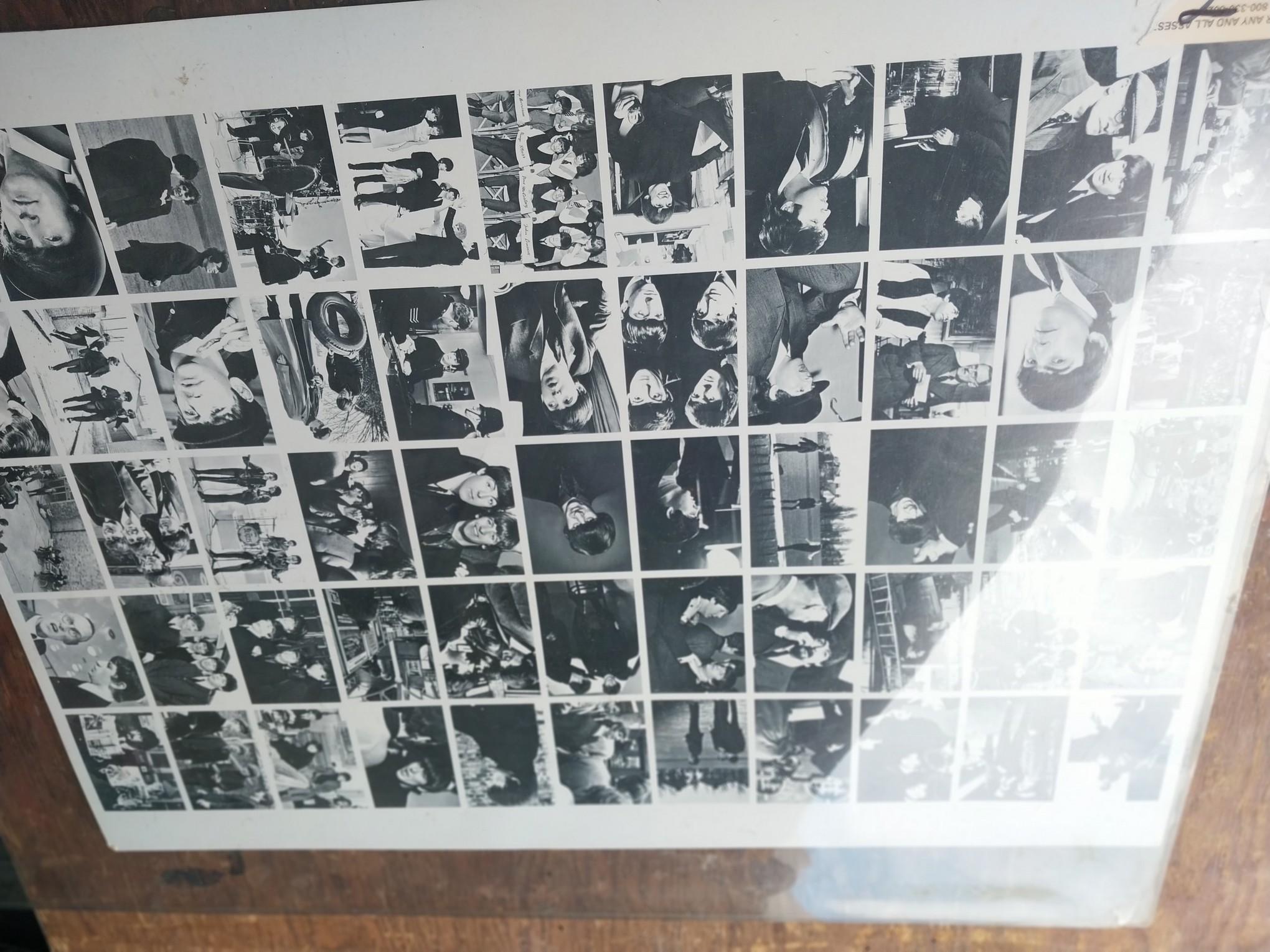 Uncut Sheet of Beatles photographs - plastic cover to be replaced