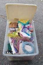 Ribbons and more with plastic container