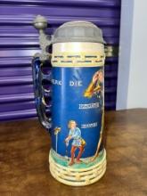 A Tall Tankard 12" High Featuring David and Goliath with Hinged Lid and Finger Cutouts