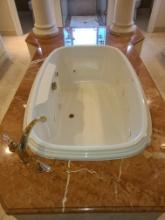 Whirlpool Tub with Gold tone Fixtures