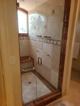 Glass Shower Doors and Gold tone Fixtures with multi head shower