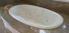 Whirlpool Tub with Gold tone Fixtures