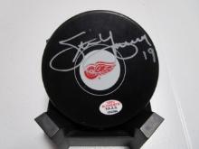 Steve Yzerman of the Detroit Red Wings signed autographed logo hockey puck PAAS COA 294