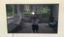 64 in Sunbrite Flat screen television with bracket
