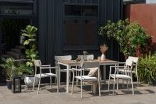 BRAND NEW ORIGINAL PACKAGING 59" BY 35" OUTDOOR ALUMINUM TABLE WITH 4 STACKING ALUMINUM CHAIRS