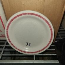 Round speckled plate with red rim