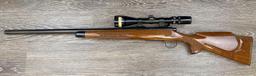 REMINGTON MODEL 700 .243 WIN CALIBER BOLT-ACTION RIFLE W/SCOPE.