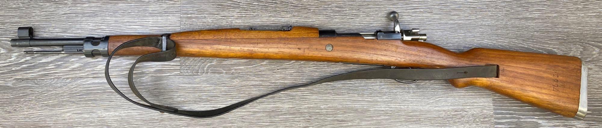 MAUSER MODEL M48A 8MM MAUSER CALIBER BOLT-ACTION RIFLE WITH LEATHER SLING.