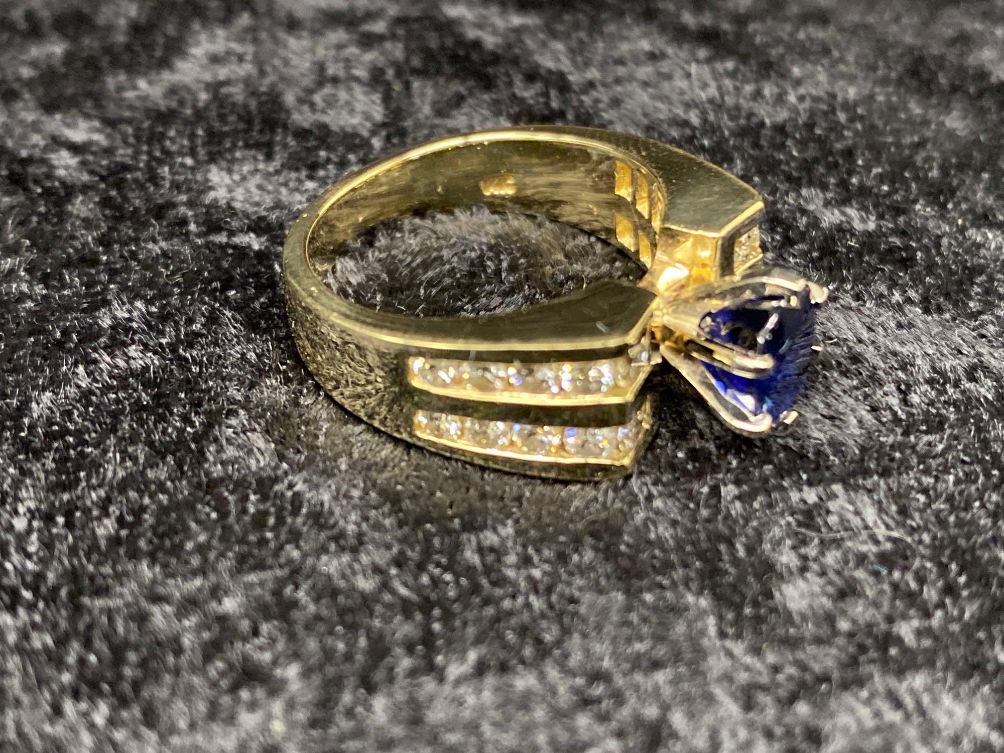 One Beautiful Ring Set with Fine Blue Sapphire and Side Diamonds in 14k Yellow Gold