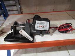 WARN 2000LB ELECTRIC WINCH ON MOUNTING BRACKET