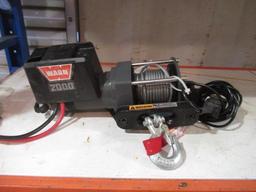 WARN 2000LB ELECTRIC WINCH ON MOUNTING BRACKET