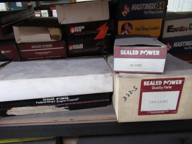 CONTENTS OF SHELF - ASSORTED PISTON RINGS & OIL PICKUPS