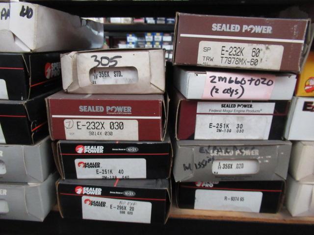 CONTENTS OF SHELF - ASSORTED PISTON RINGS & OIL PICKUPS