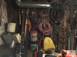 Contents of wall: Mobile can, hoses, cable, tarps, wire, etc.