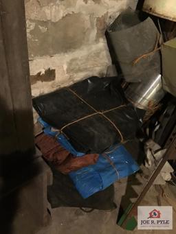 Contents of wall: Mobile can, hoses, cable, tarps, wire, etc.