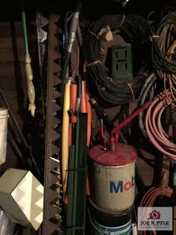 Contents of wall: Mobile can, hoses, cable, tarps, wire, etc.