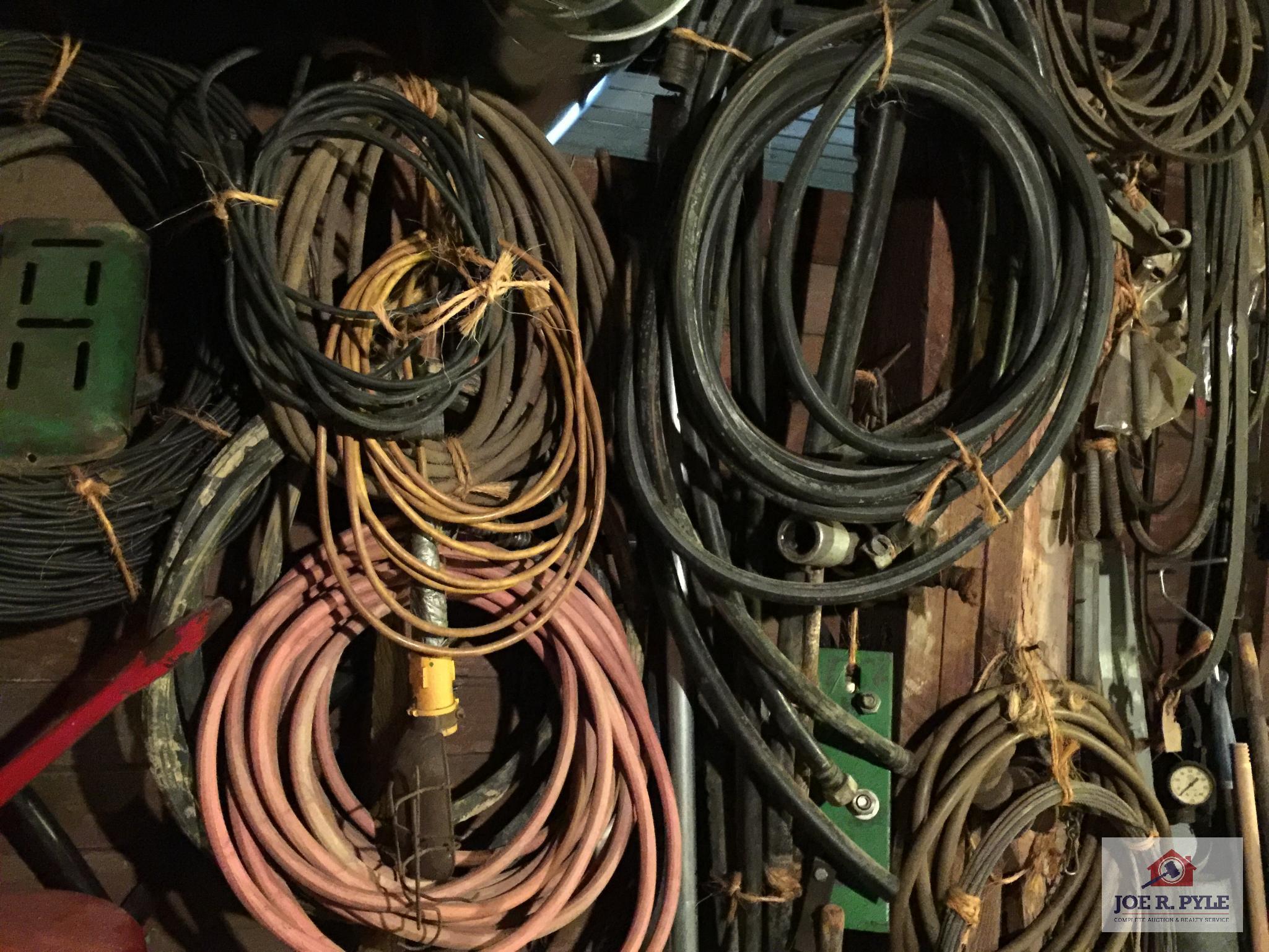Contents of wall: Mobile can, hoses, cable, tarps, wire, etc.