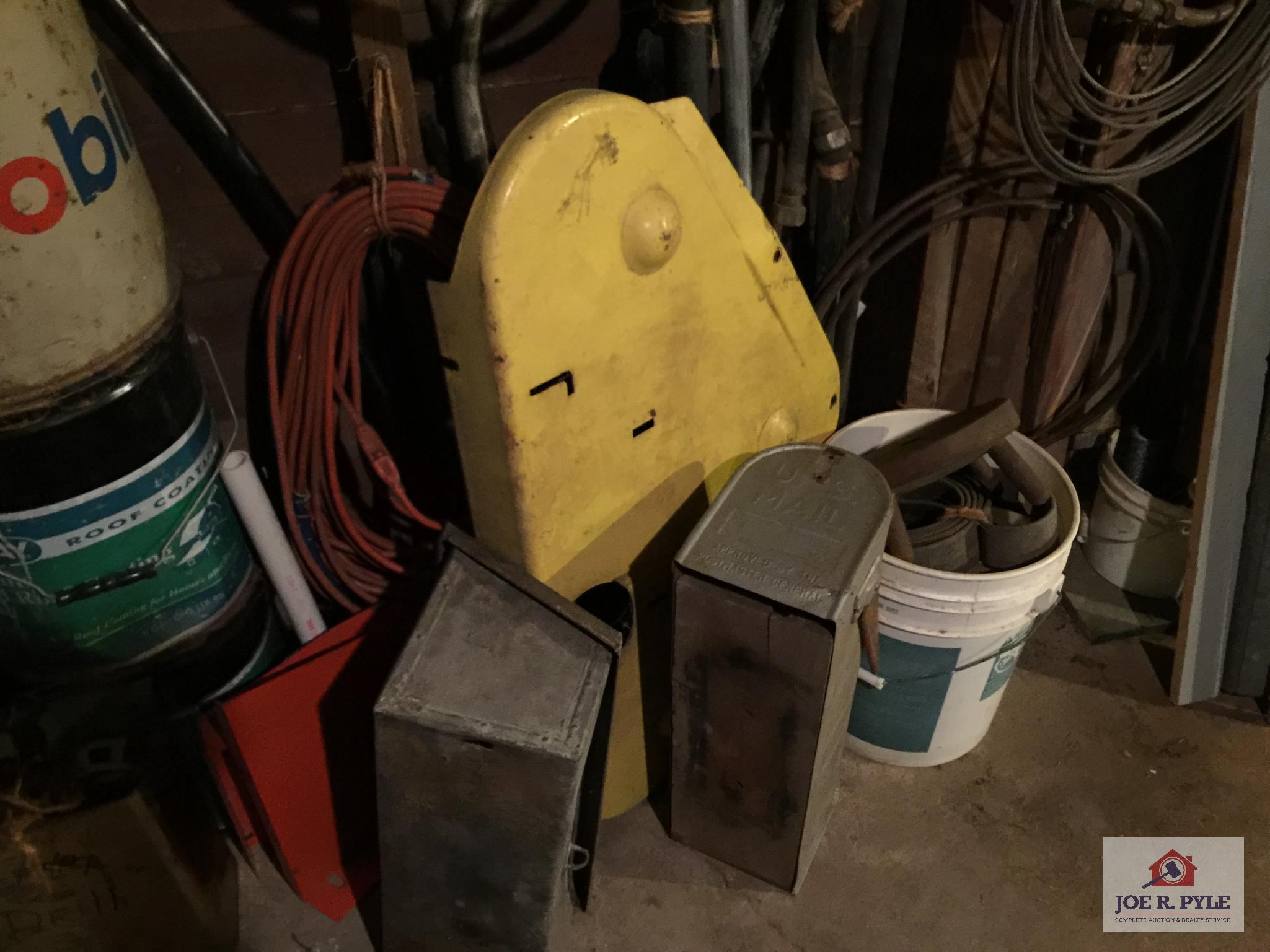 Contents of wall: Mobile can, hoses, cable, tarps, wire, etc.