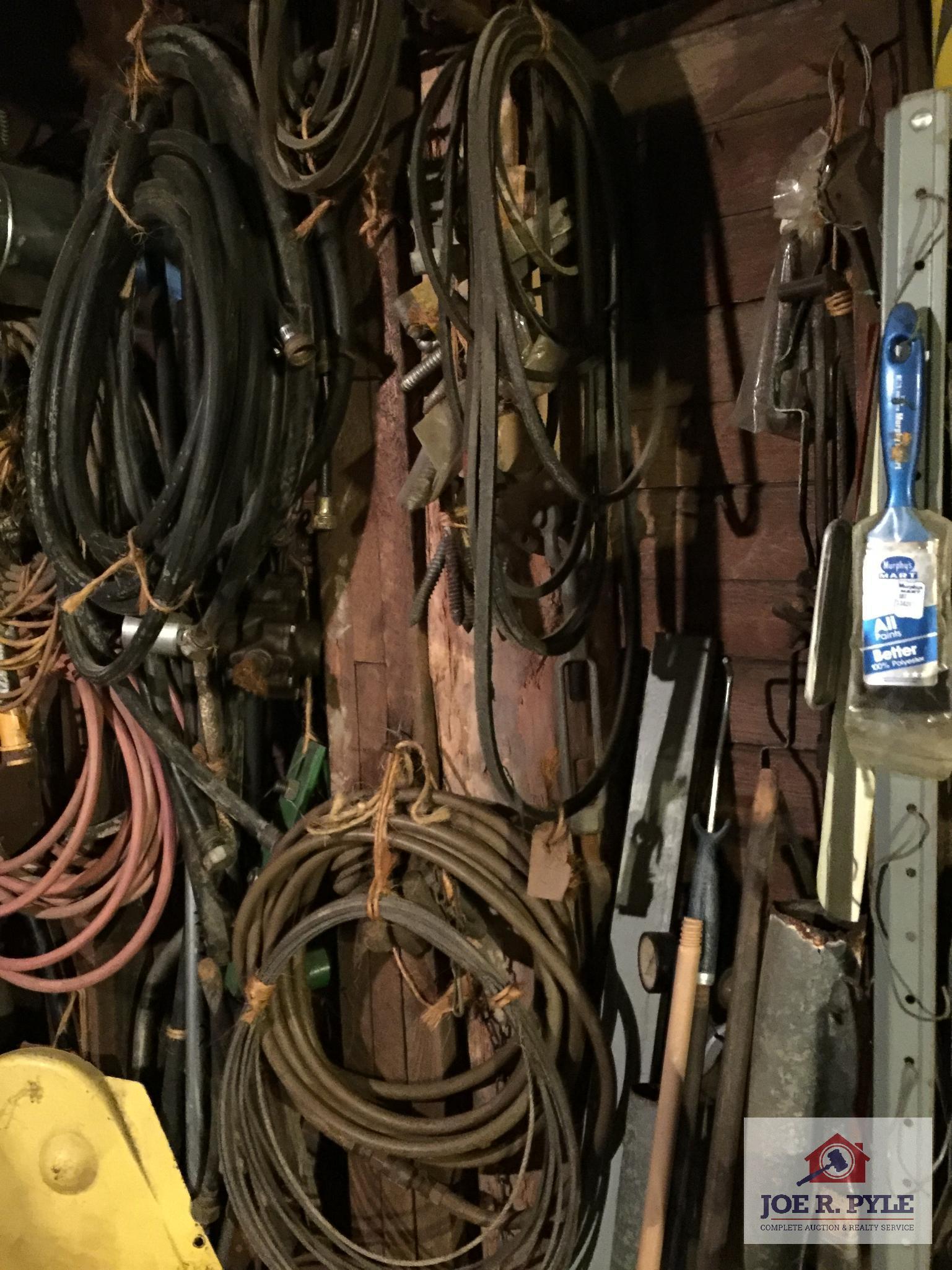Contents of wall: Mobile can, hoses, cable, tarps, wire, etc.