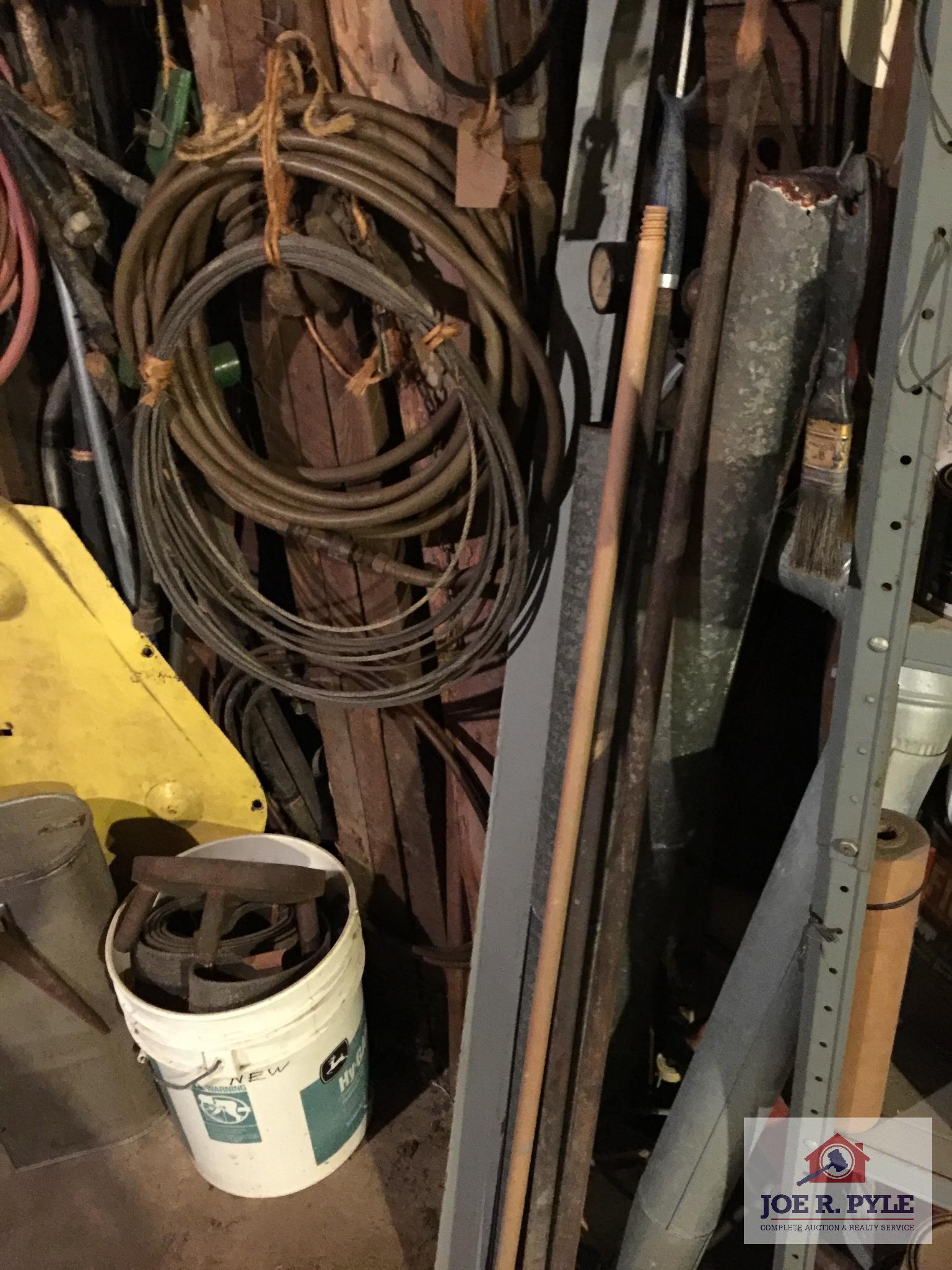 Contents of wall: Mobile can, hoses, cable, tarps, wire, etc.