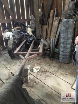 Lot in corner: old frame with wheels and tires, metal fencing, etc.
