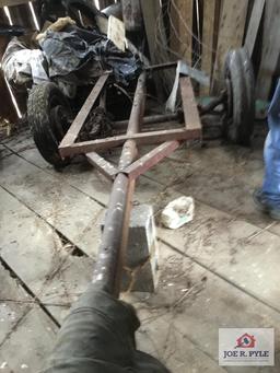 Lot in corner: old frame with wheels and tires, metal fencing, etc.