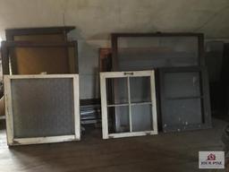 Lot of antique windows in attic. Original windows in house.