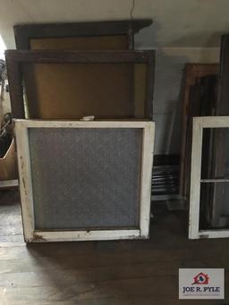 Lot of antique windows in attic. Original windows in house.