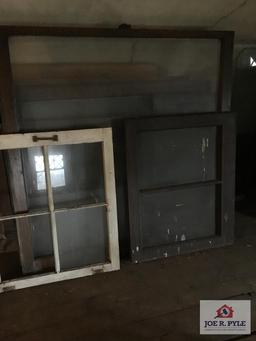 Lot of antique windows in attic. Original windows in house.