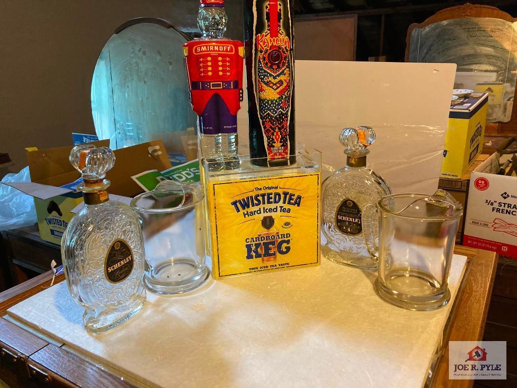 Four vintage liquor decanters, two glass beer pitchers, Twisted Tea bar display