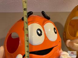 2 M & M store displays on wheels Orange 37" x 24" x 17" and yellow 41" x 18" x 17"