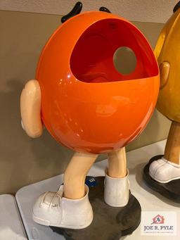 2 M & M store displays on wheels Orange 37" x 24" x 17" and yellow 41" x 18" x 17"