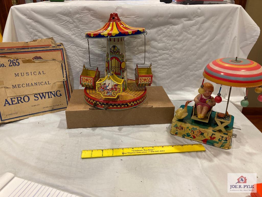 J. Chein Aero Swing with box and Tin and celluloid girl and umbrella, tested