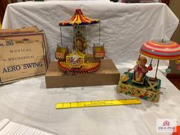 J. Chein Aero Swing with box and Tin and celluloid girl and umbrella, tested