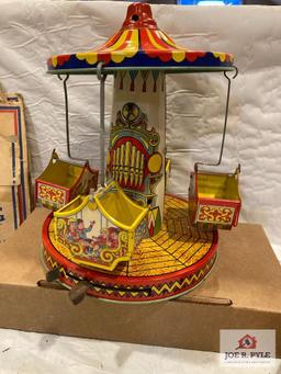 J. Chein Aero Swing with box and Tin and celluloid girl and umbrella, tested