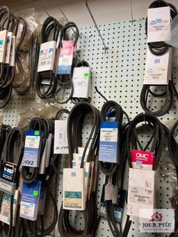 Assortment of Belts Hanging on Wall