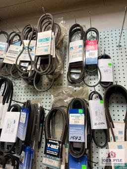 Assortment of Belts Hanging on Wall